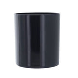 Black cylindrical candle vessel on a white background